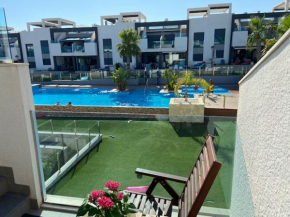 Oasis Beach 9, 1st floor luxury flat 87m2 with pool and private sun deck and terrace next to the living room.